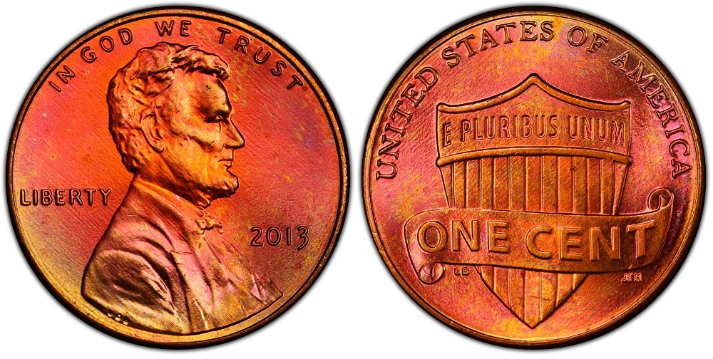 Grading strip showing four 2013 pennies from worn to gem uncirculated demonstrating condition differences